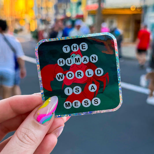 The Human World Is A Mess Glitter Sticker